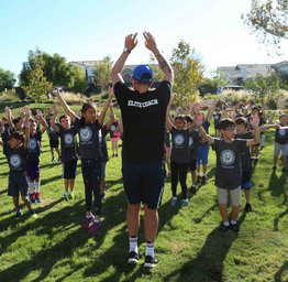 students doing jumping jacks