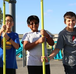 students playing on jungle gym